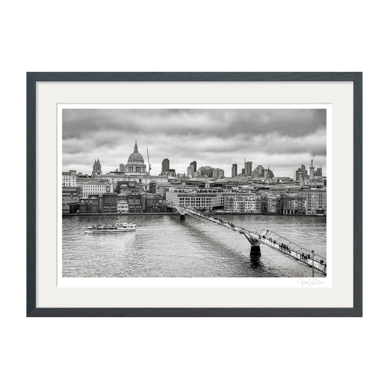 Framed black and white fine art print of London architecture displayed in modern living room.