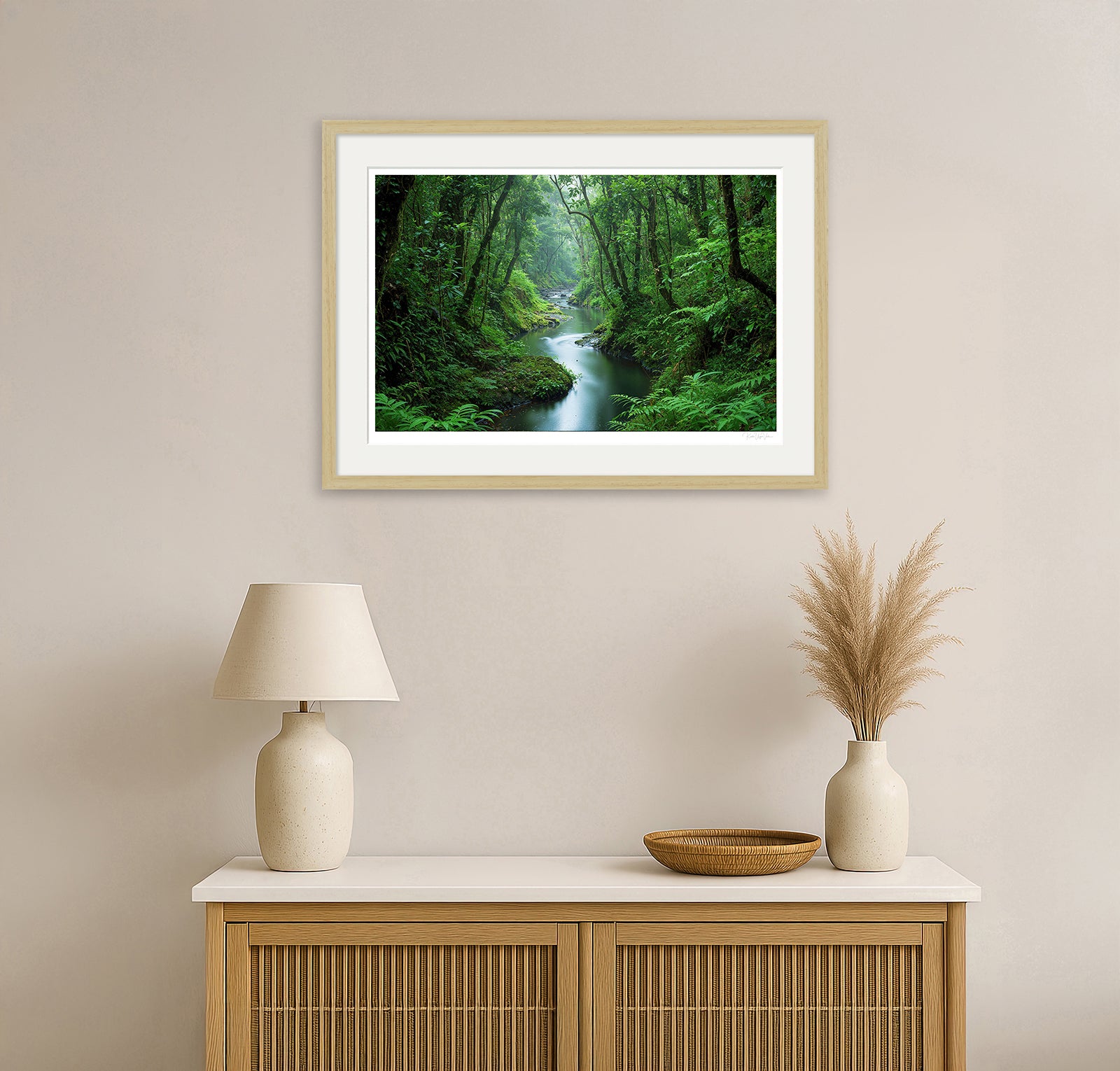 Green forest and river landscape framed in natural wood – tranquil wall art mockup above console table