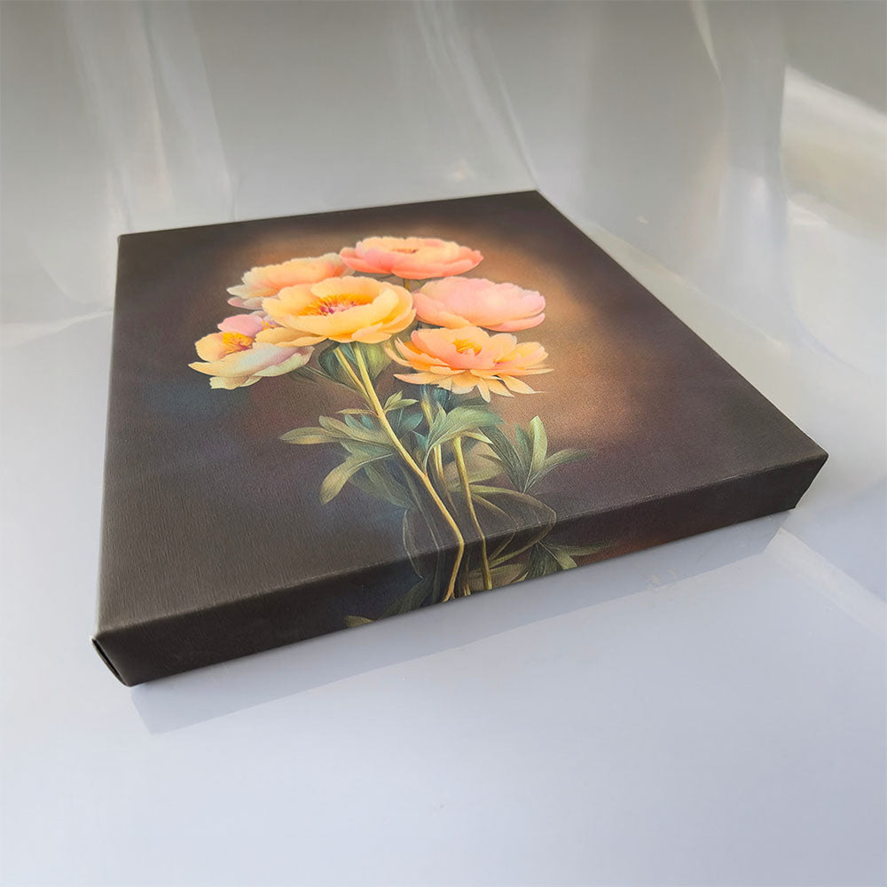 Angled view of a framed art print on a light surface, showcasing a dark-toned floral image with yellow and pink blooms, highlighting its decorative appeal.