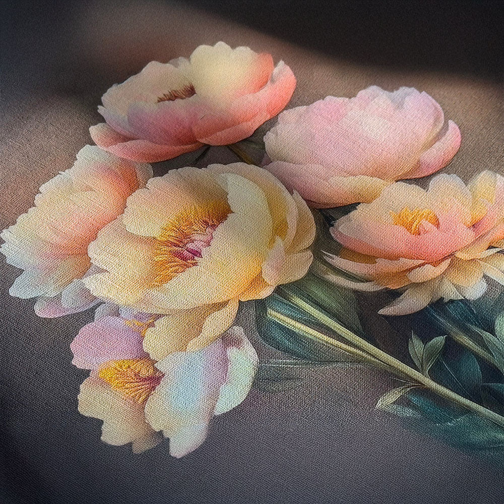 Square close-up of delicate yellow and pink flowers with green foliage against a dark, moody background, emphasizing the pastel tones and natural atmosphere.