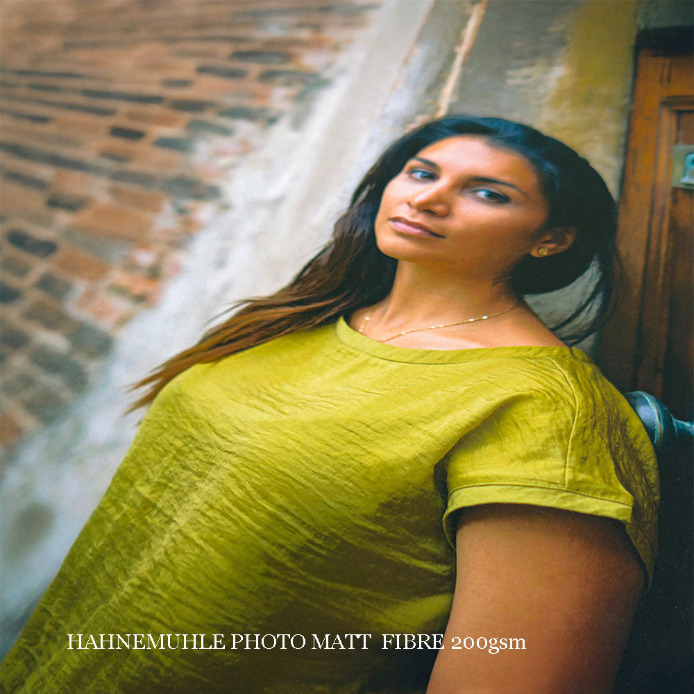 Portrait of a woman in a green shirt on Hahnemuhle Photo Matt Fibre 200 gsm paper, highlighting fine art quality.