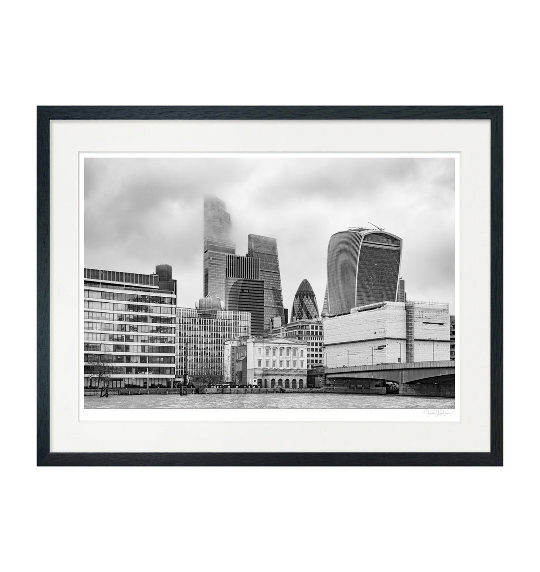 Framed black and white London skyline art print with iconic skyscrapers, presented with white mount and black wooden frame