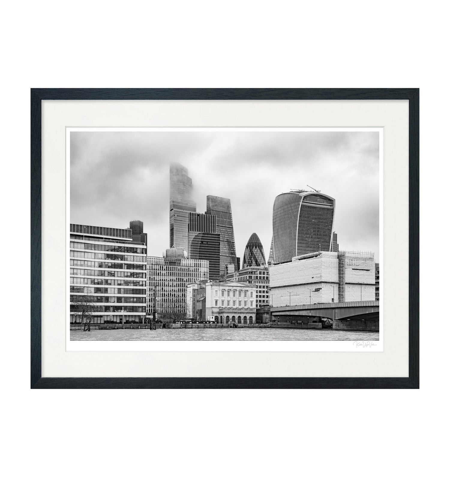 Framed black and white London skyline art print with iconic skyscrapers, presented with white mount and black wooden frame