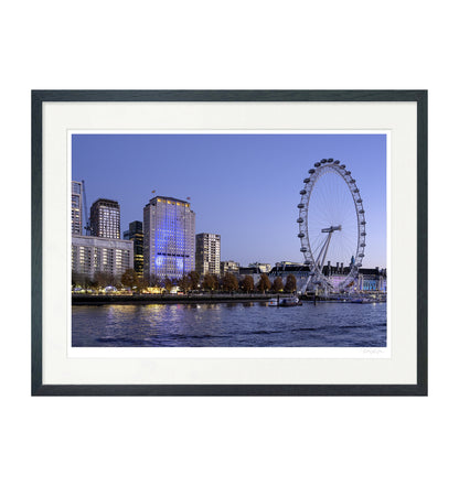 Framed wall art of the London Eye at dusk, printed on fine art paper with white mount and black wooden frame