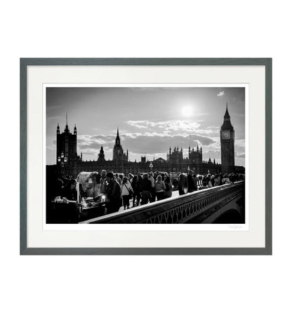  Framed black and white wall art print of Westminster Bridge and Big Ben with street life, grey wooden frame, fine art photography by Kadir Ugur Varli.