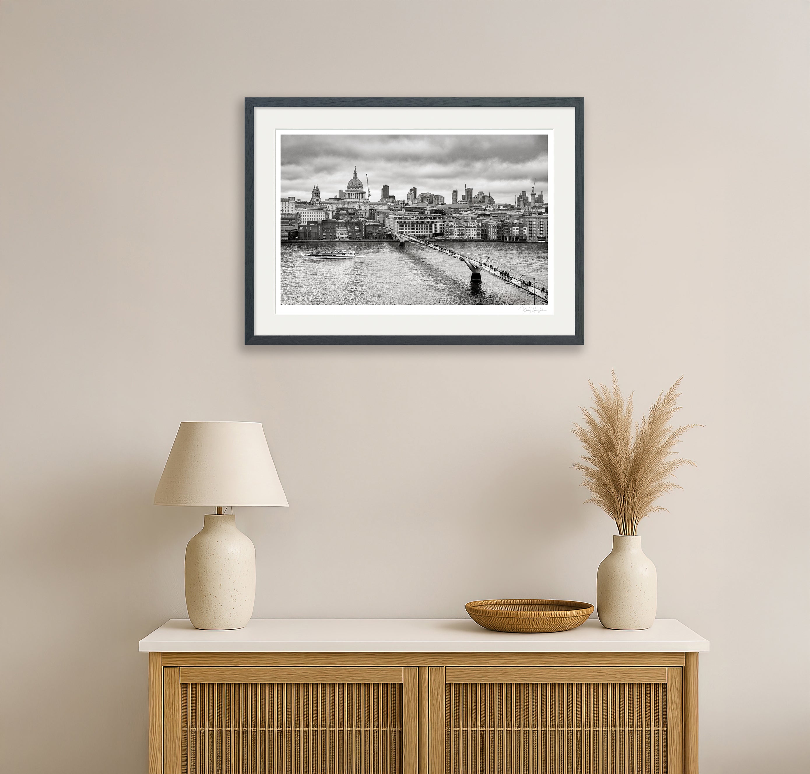 London cityscape black and white framed print displayed above a modern console in neutral-toned living room