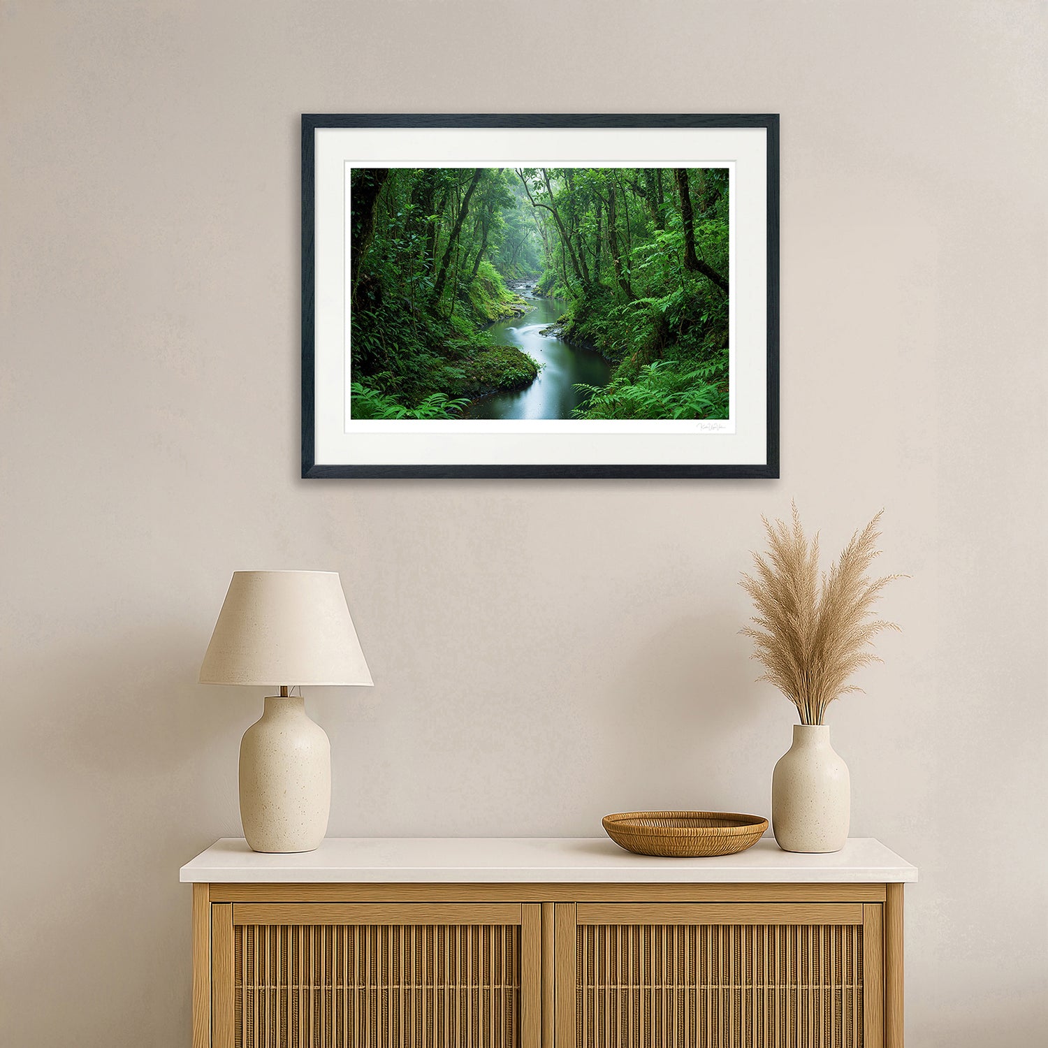 Generative autumn landscape with golden trees and river – framed in natural wooden frame above console table

