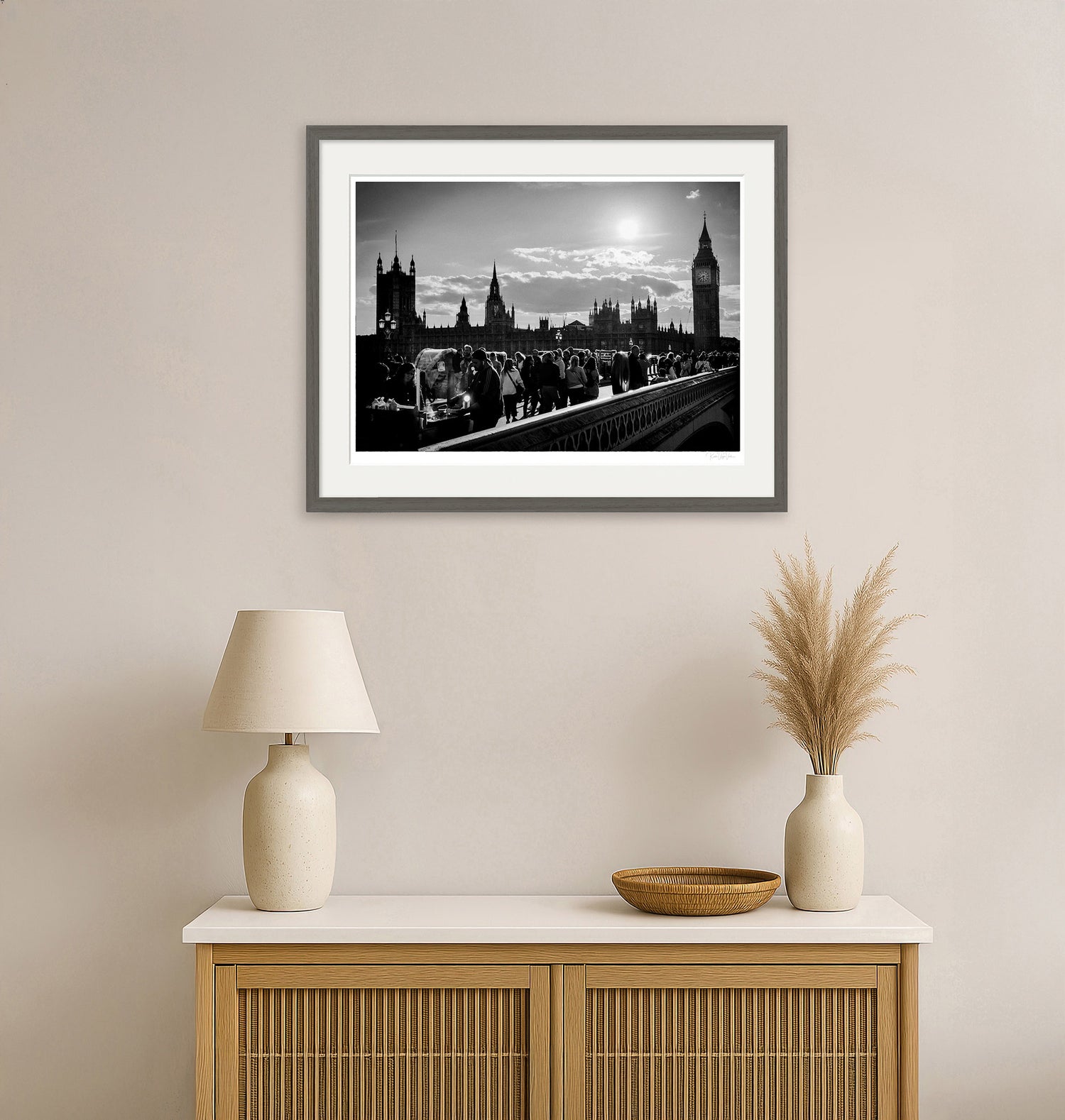 Modern living room with monochrome London wall art framed in grey, featuring Big Ben and Westminster Bridge.