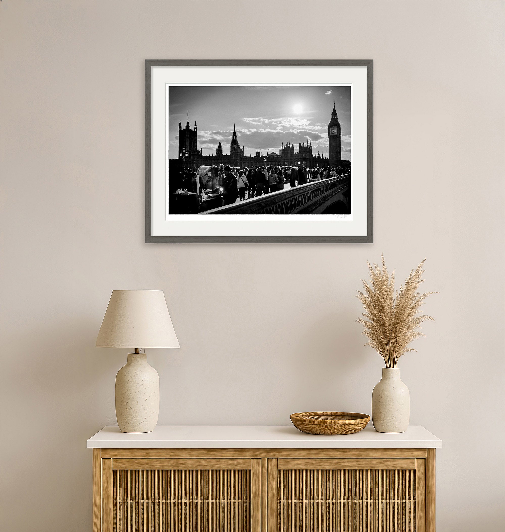 Modern living room with monochrome London wall art framed in grey, featuring Big Ben and Westminster Bridge.