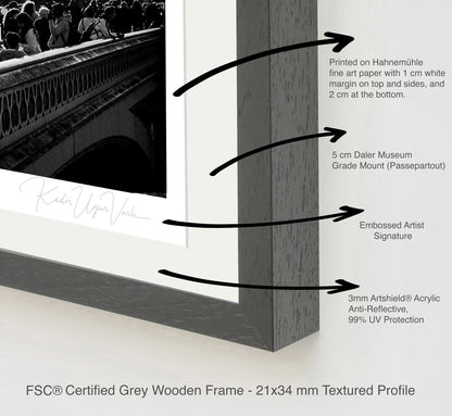 FSC-certified grey wooden frame with 5cm museum-grade mount, 3mm anti-reflective acrylic, embossed artist signature.