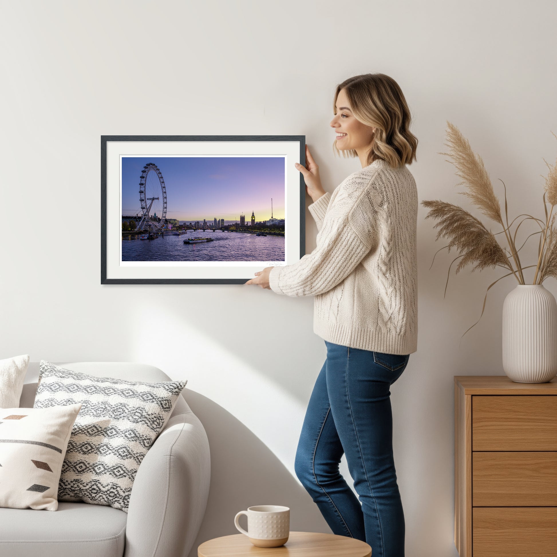 Woman holding horizontal London Eye and River Thames framed artwork – fine art print wall size reference