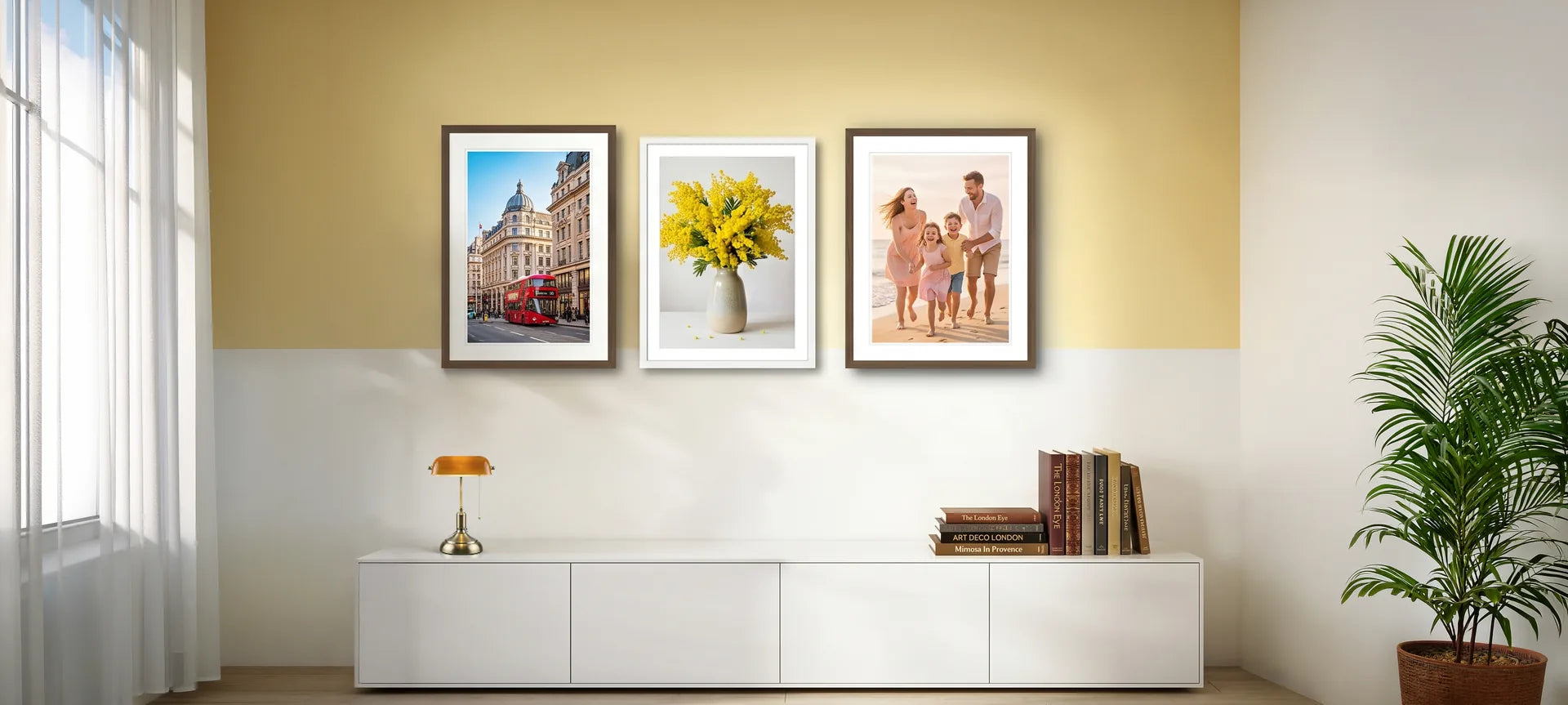 Framed fine art prints of London, mimosa flowers and a family beach photo on a living room wall — GiftlyArtPrint fine art studio, Maidstone